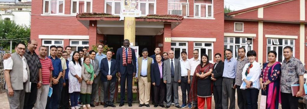 Secretary General As Sy in NRCS office with Red Cross workers